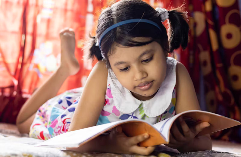 Child reading a book